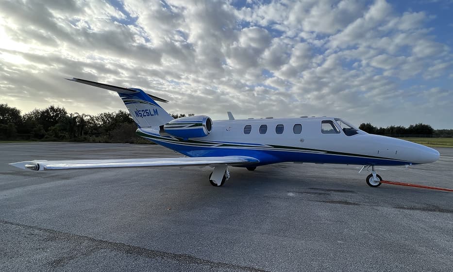 Business jet after aircraft painting with custom metallic livery and ceramic clear coat by Ace Aircraft Refinishing