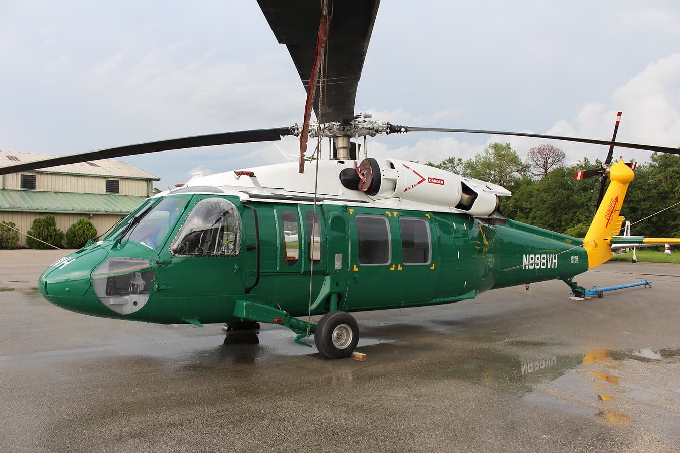 Operational helicopter after complete exterior refinishing with aviation-approved Sherwin Williams coatings by Ace Aircraft Refinishing