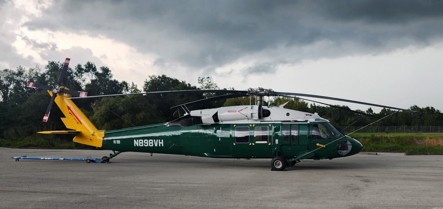 Helicopter mid-refinishing at Ace Aircraft Refinishing's Bartow, Florida paint hangar